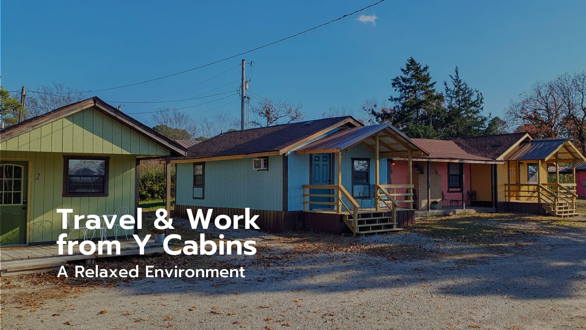 Colorful cabins with porches in a peaceful outdoor setting.